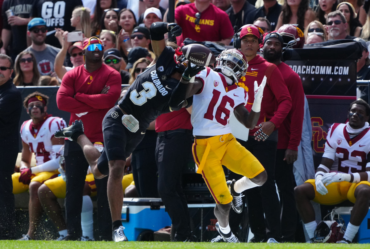 Colorado Buffaloes cornerback Christian Gonzalez (3) breaks up a pass to USC Trojans wide receiver Tahj Washington (16).